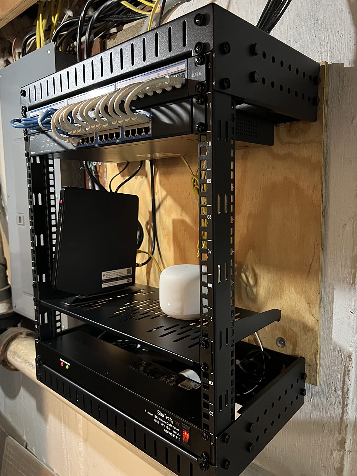 StarTech 15U 2-Post Wall Mount Open Frame Rack, 19in, 200lb (RK15WALLOA) | Adjustable depth 12-20in, SPCC cold-rolled steel, M6 cage nuts and screws, Heavy-duty 90kg capacity customer photo 1